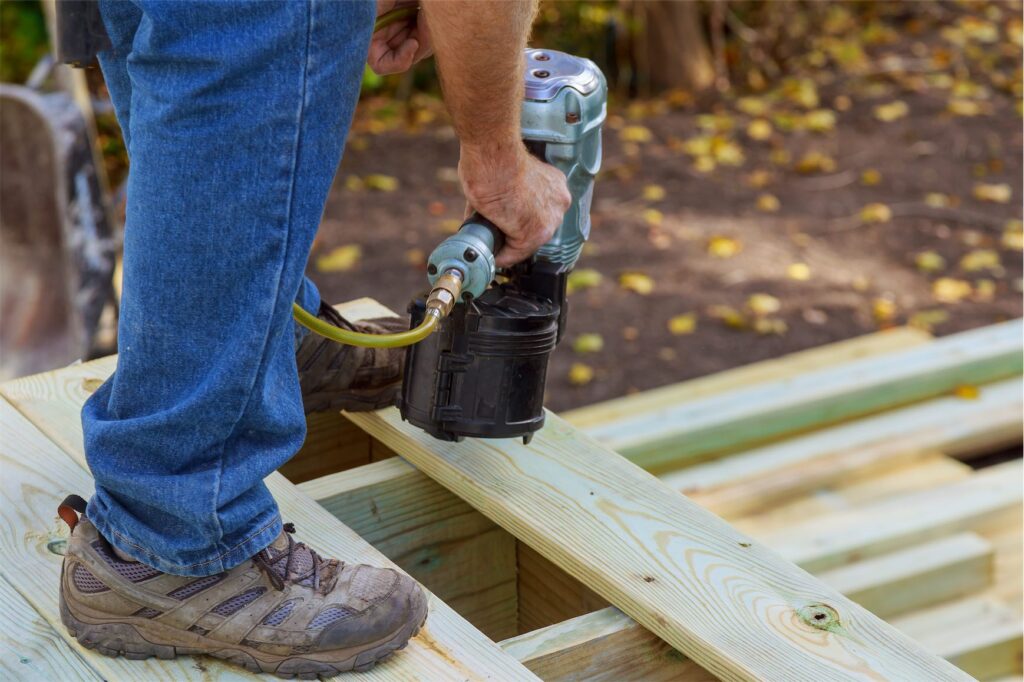 tømrermester - Design Tømreren Jack Haugaard - handyman installing wooden flooring in patio work 2022 12 06 23 57 02 utc - Hjem